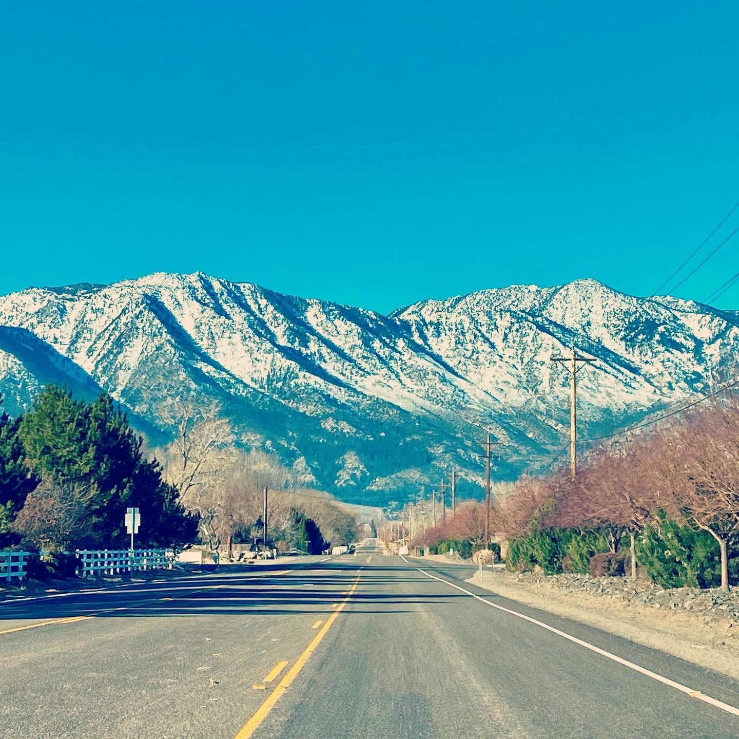 Road leading toward snow-covered mountains