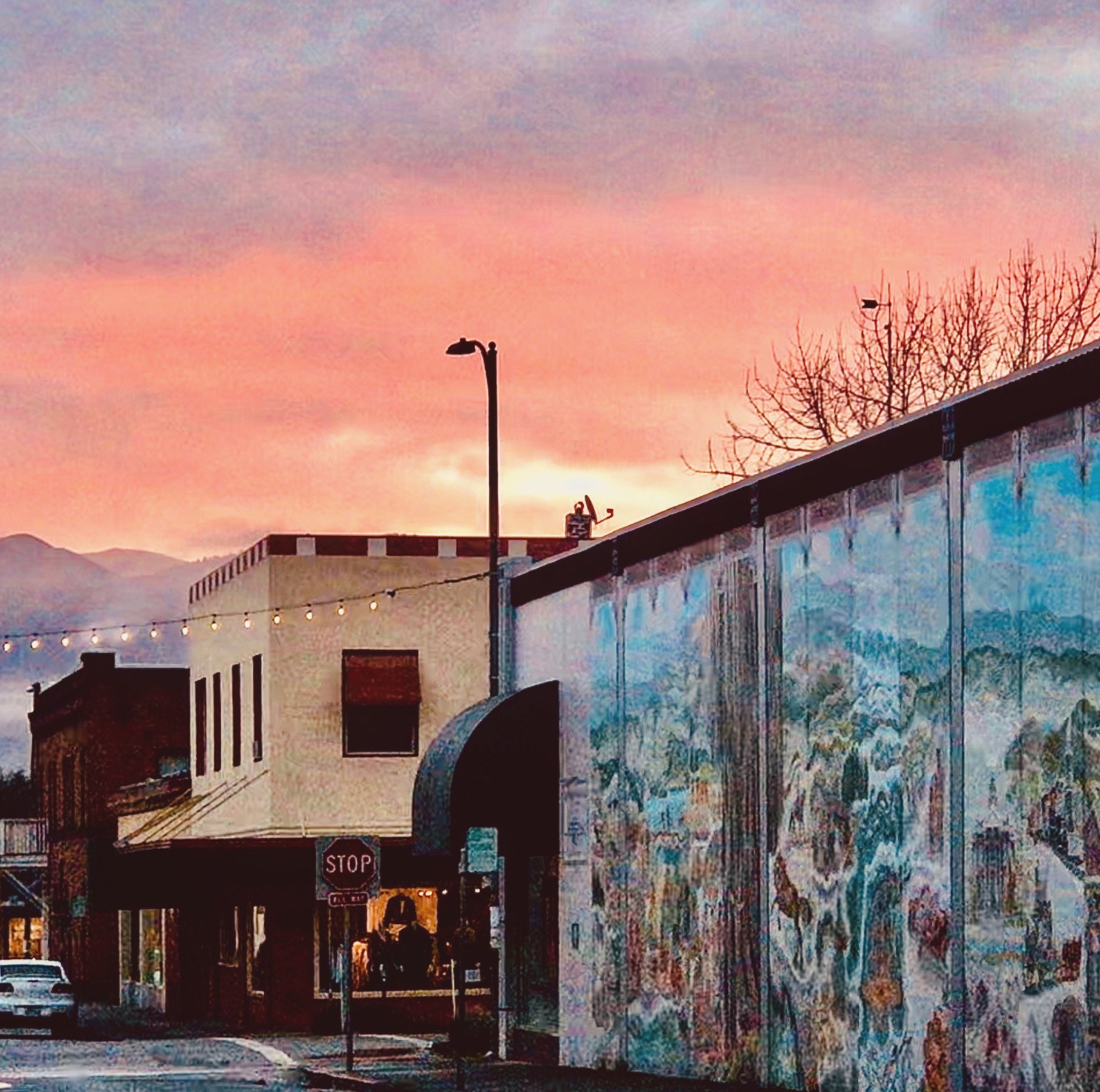 Downtown mural and streetscape at sunset in Ukiah, California